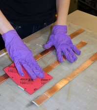 Cleaning the copper hanger straps