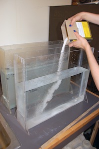 Pouring salt into tank